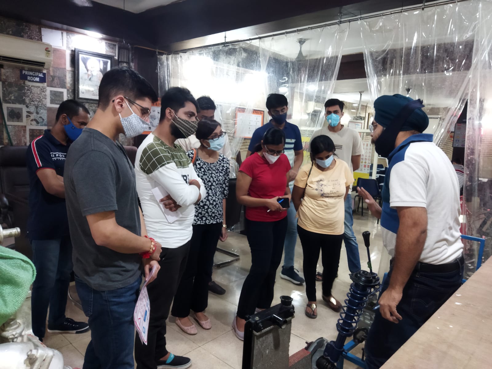 Our Expert Showing Car Engine to Student at PRM Car Driving School